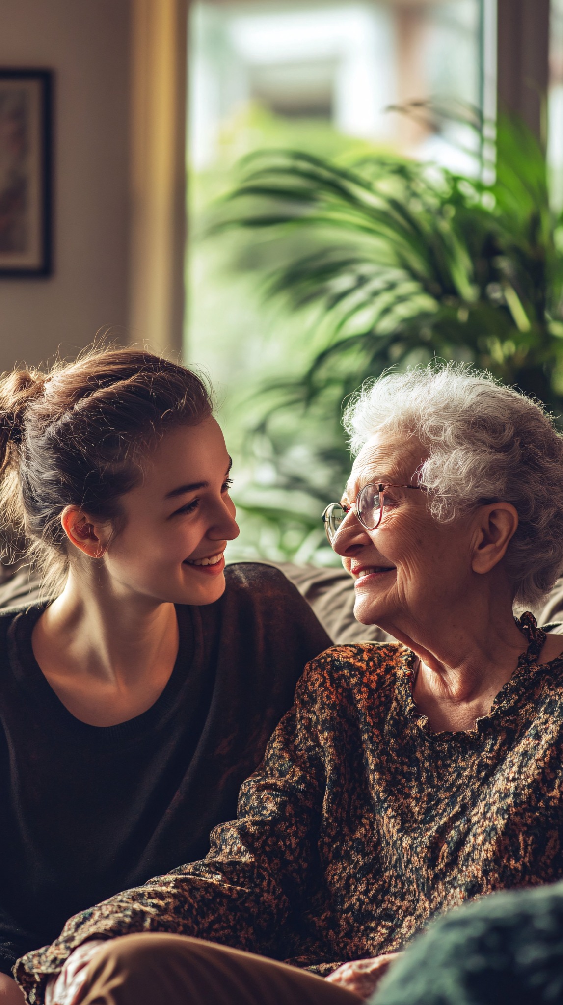 A caring companion sharing a warm conversation with an older adult at home
